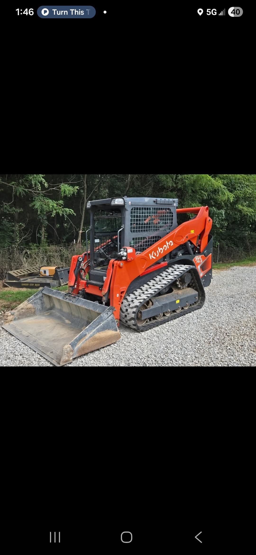 Owensboro excavation company skid steer working a rural KY site